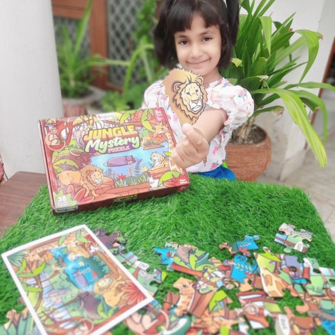 child playing jungle mystery puzzle on floor