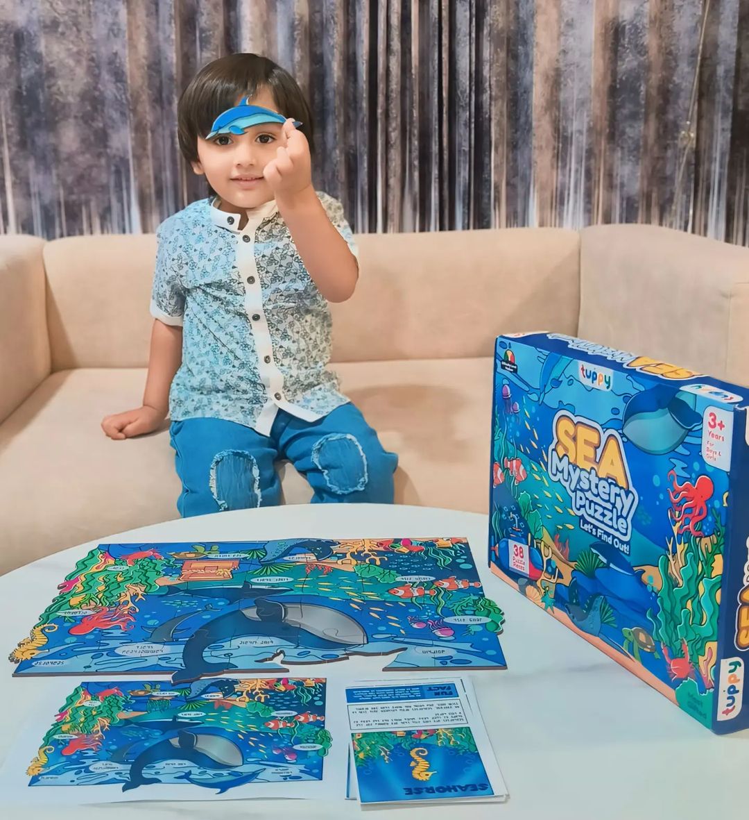 child playing with sea mystery puzzle
